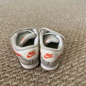 Toddler Nike’s with orange logo, size 6
